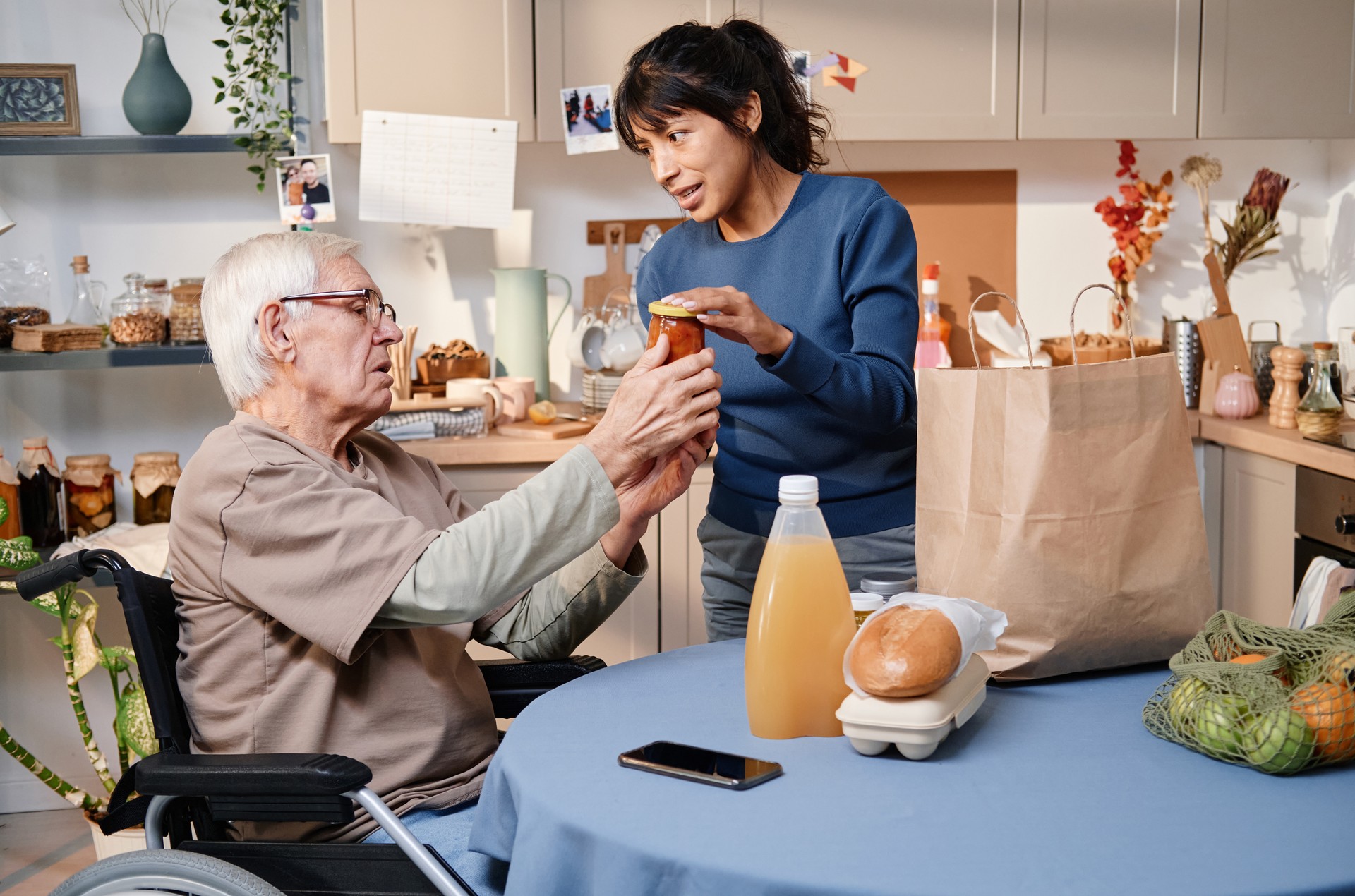 Woman buying food for senior man